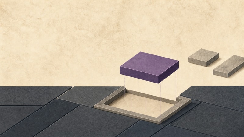 A purple architectural block aligns above an open bay in a connected field while two stone blocks remain outside.